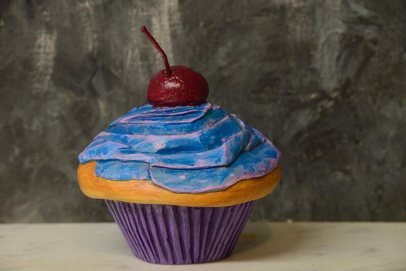 photo of wood artwork that looks like a cupcake