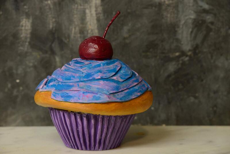 photo of wood artwork that looks like a cupcake