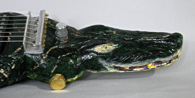 photo of alligator head from alligator lap steel