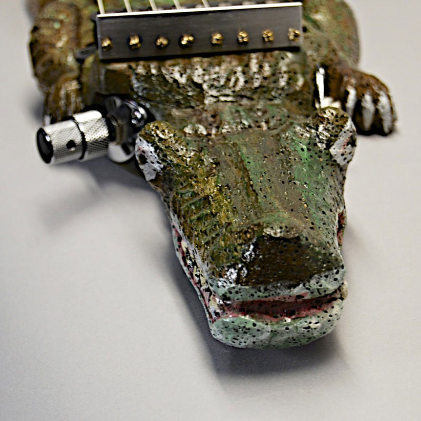closeup photo of alligator lap steel #1